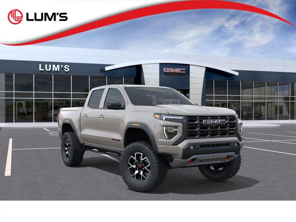 2026 GMC Canyon AT4X in Coastal Dune — front three-quarter view
